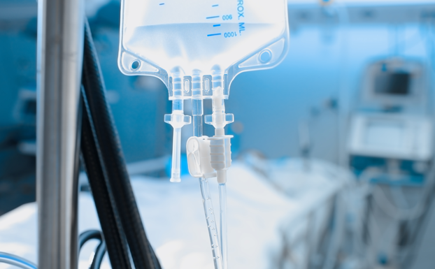 Intravenous drip on the background of patient under the heart monitoring. Source_istockphoto.com. Credit_sudok1