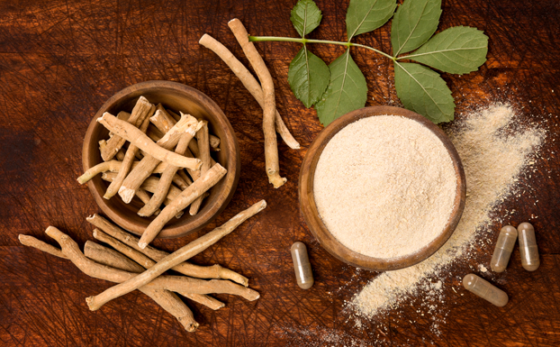 Ashwagandha-superfood-powder-and-root-on-cutting-board-on-wooden-table-from-above_Adaptogen_istockphot.com_Credit_eskymaks