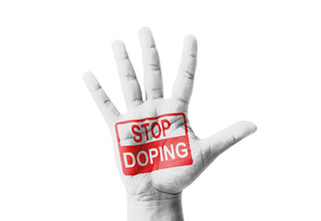 Open hand raised with Stop Doping sign painted